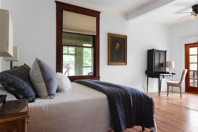 1917 Miles Ave, Austin, TX 78745 - bedroom featuring light wood-type flooring, crown molding, and beam ceiling