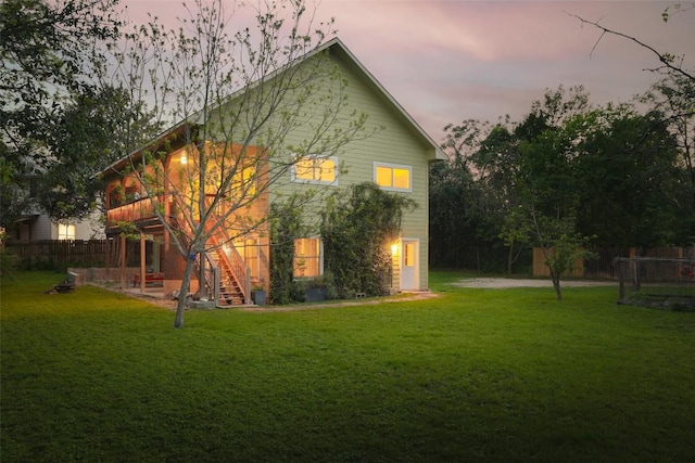1917 Miles Ave, Austin, TX 78745 - back of property at dusk featuring stairs and a deck
