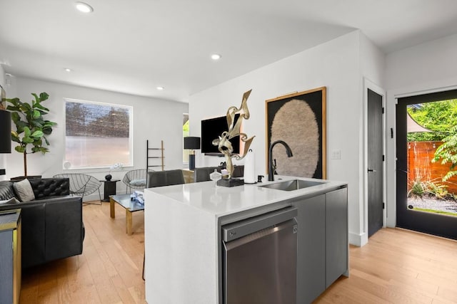 4802 Gladeview Dr Unit 2, Austin, TX 78745 - kitchen with stainless steel dishwasher, light wood-type flooring, open floor plan, healthy amount of natural light, and recessed lighting
