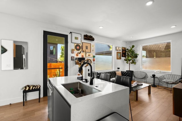 4802 Gladeview Dr Unit 2, Austin, TX 78745 - kitchen with wood finished floors, stainless steel dishwasher, recessed lighting, and light countertops