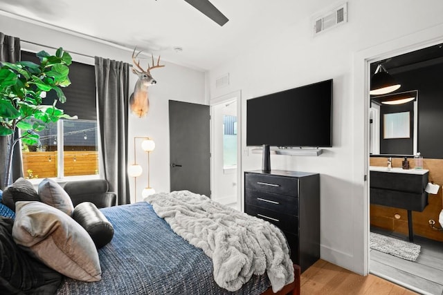 4802 Gladeview Dr Unit 2, Austin, TX 78745 - bedroom with light wood-style floors and ensuite bath
