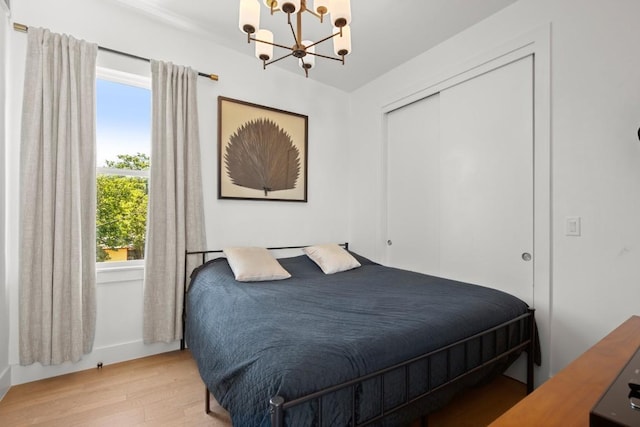 4802 Gladeview Dr Unit 2, Austin, TX 78745 - bedroom with a chandelier, light wood finished floors, and a closet