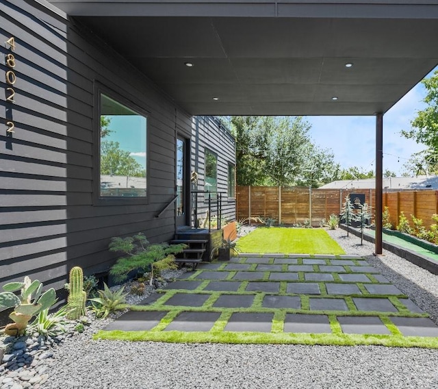 4802 Gladeview Dr Unit 2, Austin, TX 78745 - fenced backyard with a carport