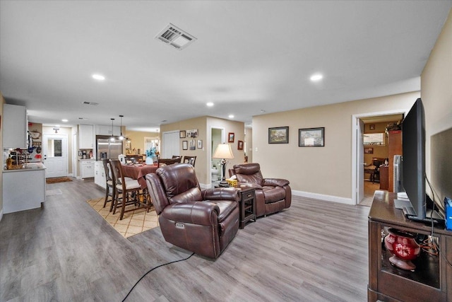 1410 Hummingbird Dr, Hillsboro, TX 76645 - living area featuring recessed lighting and wood finished floors