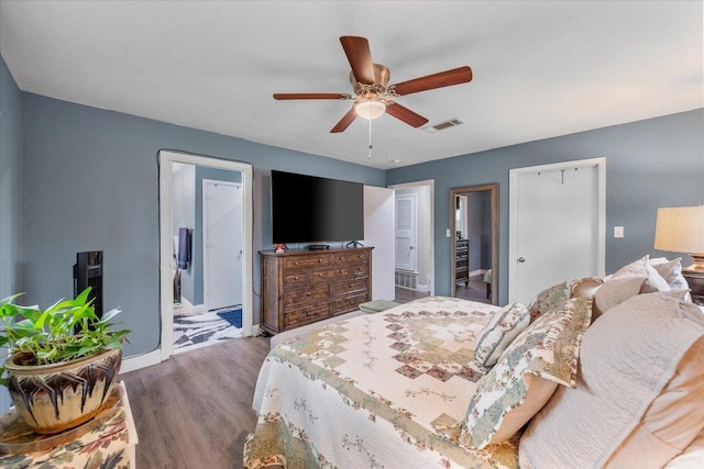 1410 Hummingbird Dr, Hillsboro, TX 76645 - bedroom with wood finished floors, a ceiling fan, and ensuite bathroom
