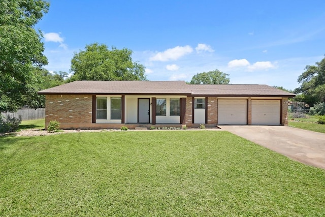 132 Spanish Oak Dr, Georgetown, TX 78628 - ranch-style home featuring an attached garage, brick siding, and concrete driveway