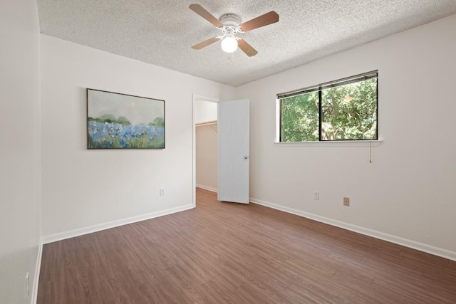 132 Spanish Oak Dr, Georgetown, TX 78628 - unfurnished room with a textured ceiling, ceiling fan, and wood finished floors