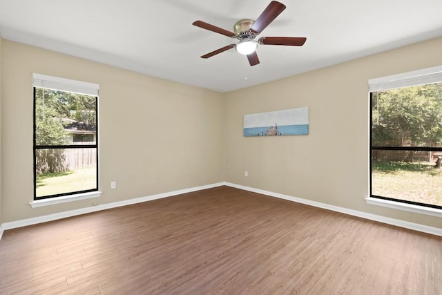 132 Spanish Oak Dr, Georgetown, TX 78628 - spare room with wood finished floors and healthy amount of natural light