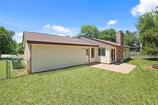 132 Spanish Oak Dr, Georgetown, TX 78628 - back of house featuring a chimney, a patio, and a gate