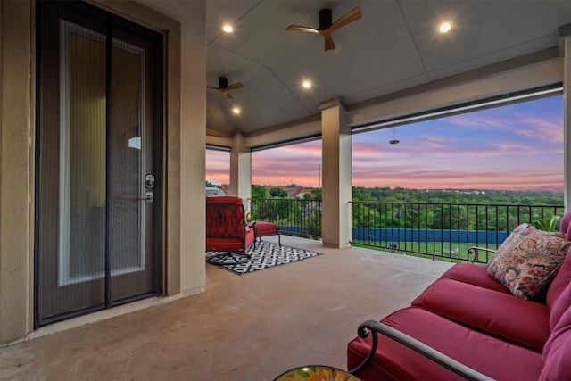 9110 Bayshore Bnd Unit 30, Austin, TX 78726 - patio terrace at dusk featuring ceiling fan and a balcony