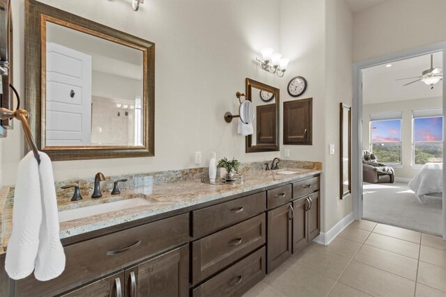 9110 Bayshore Bnd Unit 30, Austin, TX 78726 - ensuite bathroom with double vanity, tile patterned floors, and ceiling fan