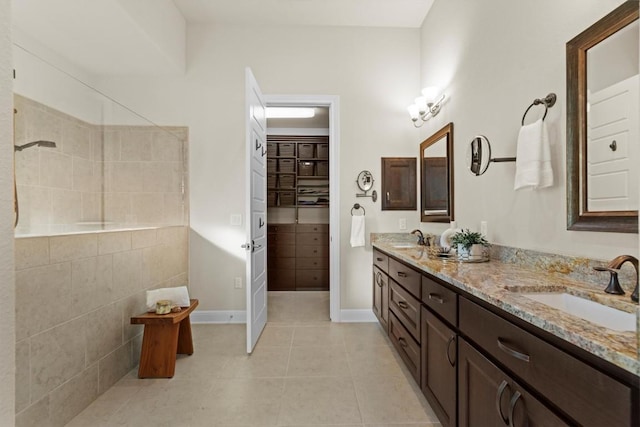 9110 Bayshore Bnd Unit 30, Austin, TX 78726 - full bath with double vanity, tile patterned floors, and a walk in shower