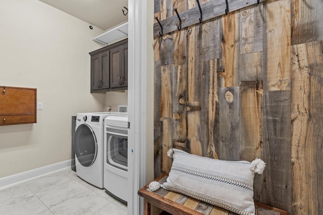 9110 Bayshore Bnd Unit 30, Austin, TX 78726 - washroom with cabinet space, washer and clothes dryer, and light marble finish flooring