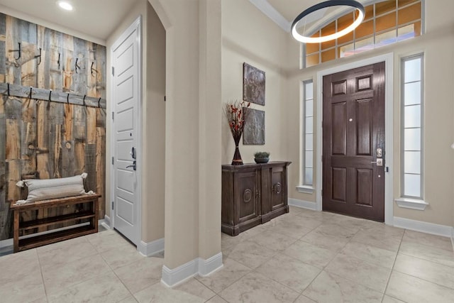 9110 Bayshore Bnd Unit 30, Austin, TX 78726 - entrance foyer with arched walkways, light tile patterned floors, ornamental molding, and a towering ceiling