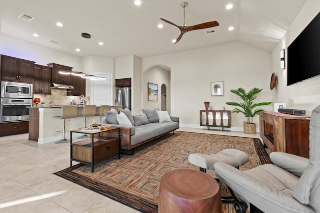 9110 Bayshore Bnd Unit 30, Austin, TX 78726 - living room featuring arched walkways, ceiling fan, recessed lighting, and vaulted ceiling