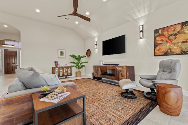 9110 Bayshore Bnd Unit 30, Austin, TX 78726 - tiled living room with recessed lighting, arched walkways, a ceiling fan, and vaulted ceiling