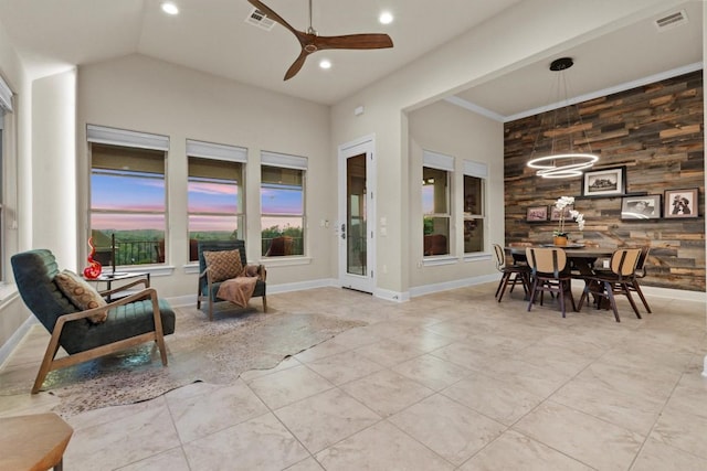 9110 Bayshore Bnd Unit 30, Austin, TX 78726 - sitting room featuring a ceiling fan, recessed lighting, tile patterned floors, wood walls, and a chandelier