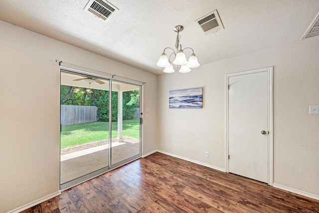 1803 Kwai Cv, Leander, TX 78641 - empty room featuring a chandelier, wood finished floors, and a textured ceiling