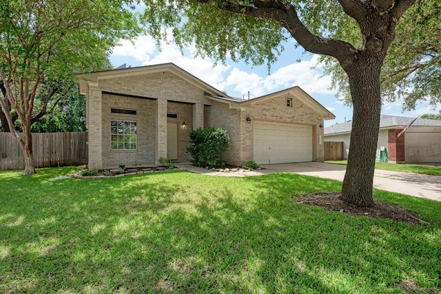 1803 Kwai Cv, Leander, TX 78641 - view of front of home with brick siding, concrete driveway, and a garage