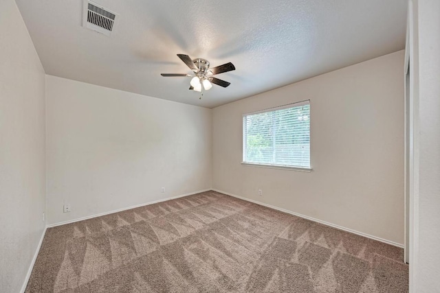 1803 Kwai Cv, Leander, TX 78641 - spare room featuring carpet and a ceiling fan