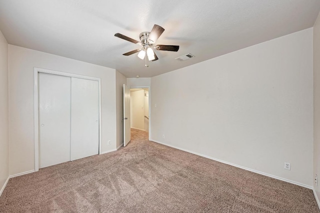 1803 Kwai Cv, Leander, TX 78641 - unfurnished bedroom featuring carpet flooring, a closet, and a ceiling fan