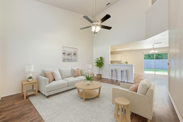 1803 Kwai Cv, Leander, TX 78641 - living room with wood finished floors, a towering ceiling, and a ceiling fan