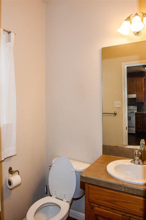 2003 White Dove Pass, Austin, TX 78734 - bathroom with toilet and vanity