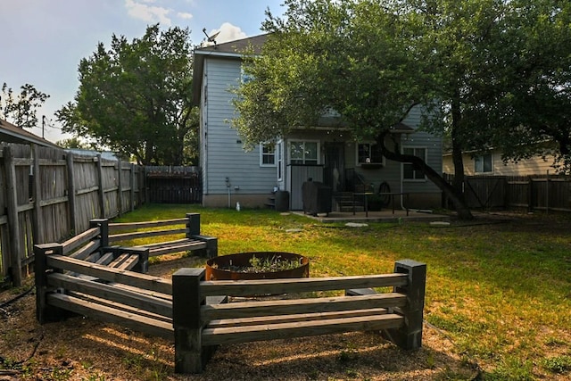 2003 White Dove Pass, Austin, TX 78734 - back of property with a fenced backyard and a patio area