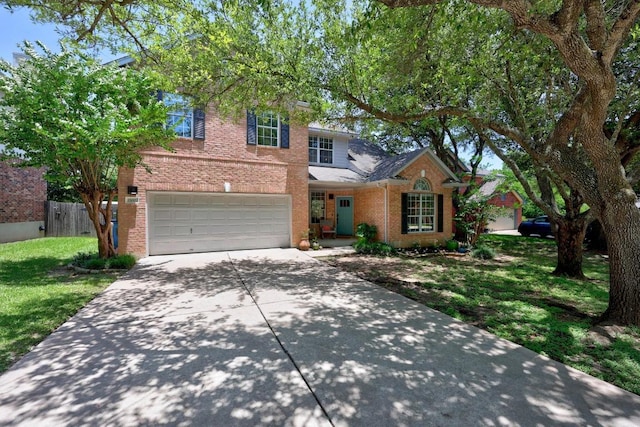 15001 Doria Dr, Austin, TX 78728 - traditional home featuring brick siding, driveway, and an attached garage