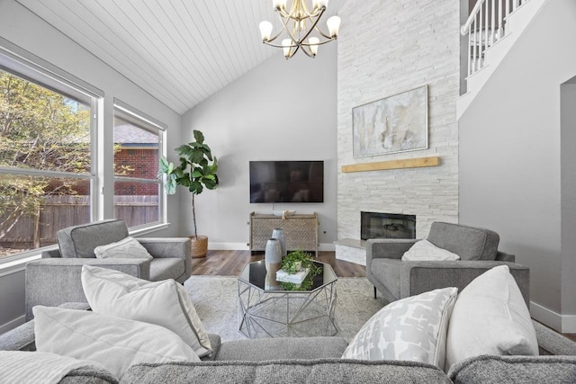 15001 Doria Dr, Austin, TX 78728 - living room featuring wood finished floors, a chandelier, a fireplace, high vaulted ceiling, and wooden ceiling