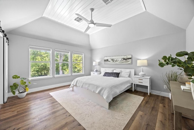 15001 Doria Dr, Austin, TX 78728 - bedroom with lofted ceiling, a ceiling fan, wood finished floors, and a barn door
