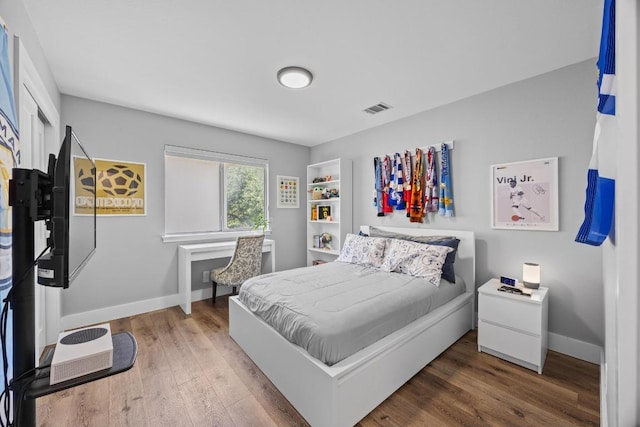 15001 Doria Dr, Austin, TX 78728 - bedroom featuring wood finished floors and baseboards