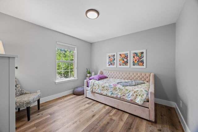 15001 Doria Dr, Austin, TX 78728 - bedroom with wood finished floors and baseboards