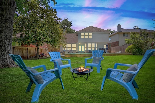 15001 Doria Dr, Austin, TX 78728 - fenced backyard featuring a fire pit