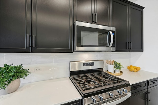 2616 Danbury Ln, Leander, TX 78641 - kitchen featuring appliances with stainless steel finishes and dark cabinets