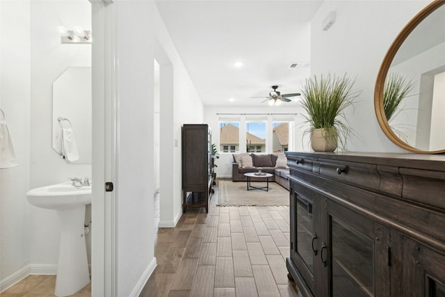 2616 Danbury Ln, Leander, TX 78641 - hallway featuring wood finished floors and recessed lighting