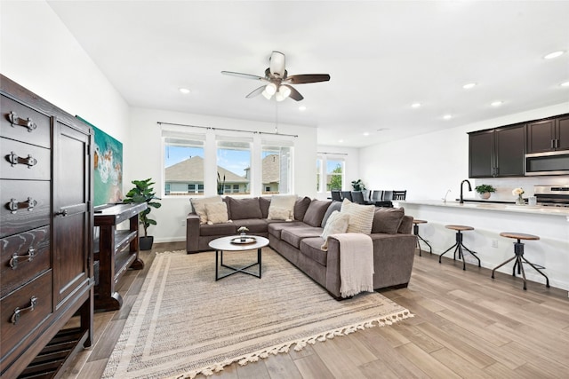 2616 Danbury Ln, Leander, TX 78641 - living area featuring a ceiling fan, light wood finished floors, and recessed lighting
