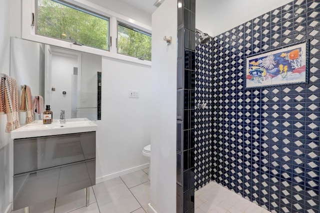 1708 Briar St, Austin, TX 78704 - bathroom with vanity, tile patterned floors, and a tile shower