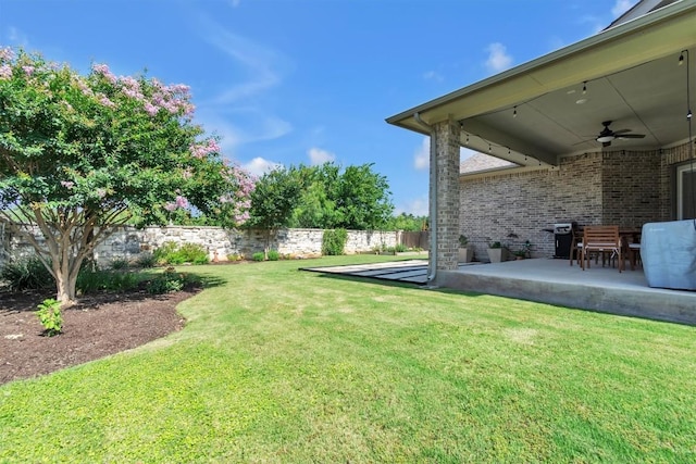 101 Dorado St, Georgetown, TX 78628 - fenced backyard featuring a ceiling fan and a patio