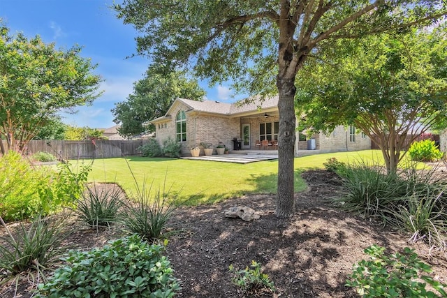 101 Dorado St, Georgetown, TX 78628 - rear view of property featuring brick siding and a patio