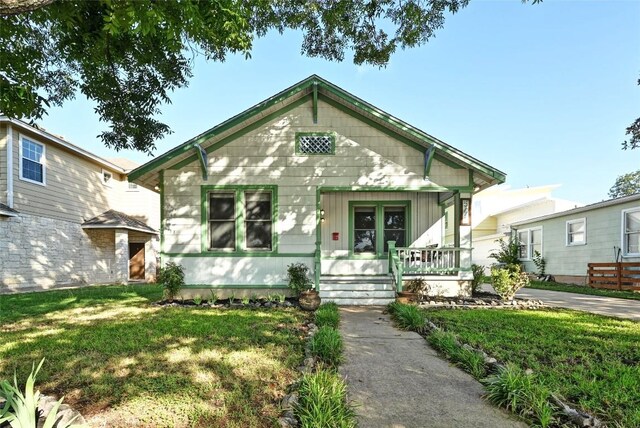 5112 Caswell Ave, Austin, TX 78751 - view of front of house with a porch and a front lawn