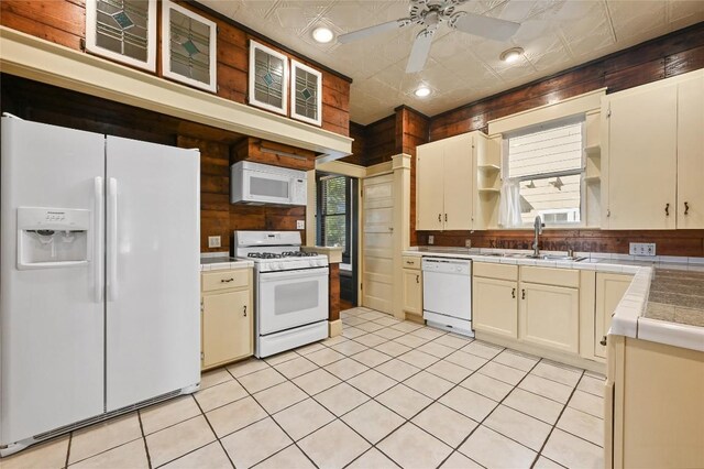 5112 Caswell Ave, Austin, TX 78751 - kitchen featuring white appliances, open shelves, ceiling fan, tile counters, and light tile patterned floors
