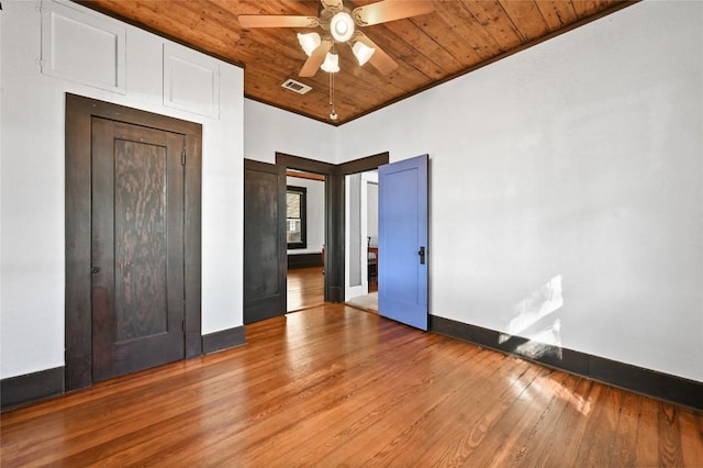 5112 Caswell Ave, Austin, TX 78751 - unfurnished bedroom with wood finished floors, wood ceiling, and ceiling fan