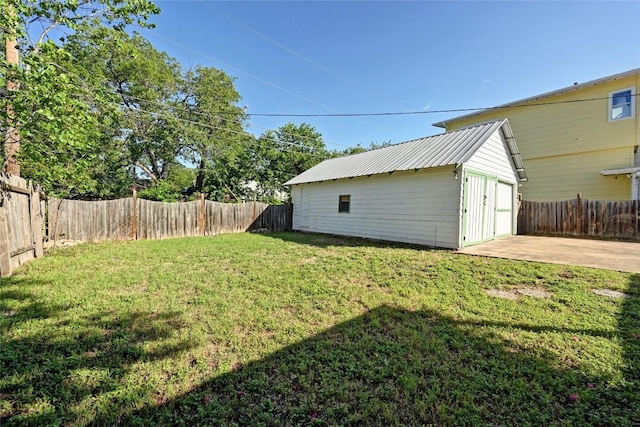 5112 Caswell Ave, Austin, TX 78751 - fenced backyard with an outbuilding, a patio area, and a detached garage