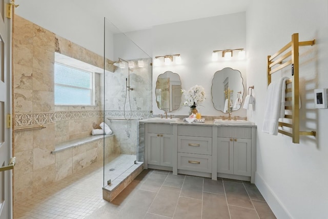 6905 Rudi Cv, Austin, TX 78759 - full bath with walk in shower, double vanity, tile patterned floors, and a towel warmer