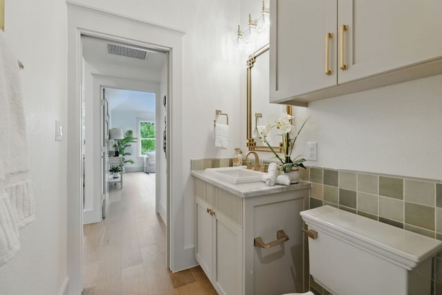 6905 Rudi Cv, Austin, TX 78759 - bathroom with vanity and wood finished floors