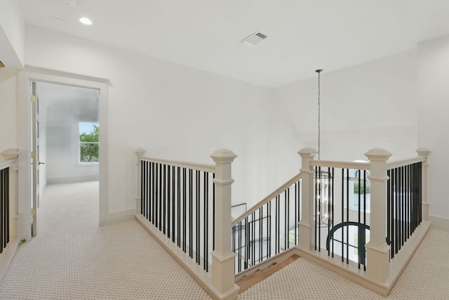 6905 Rudi Cv, Austin, TX 78759 - hall featuring an upstairs landing, carpet, and recessed lighting