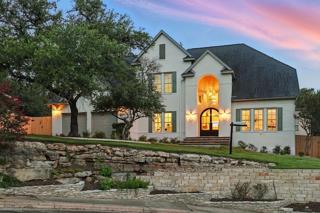 6905 Rudi Cv, Austin, TX 78759 - view of front facade with brick siding, a garage, and a shingled roof