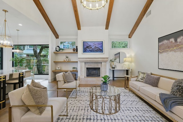 6905 Rudi Cv, Austin, TX 78759 - living area with a chandelier, a premium fireplace, beam ceiling, wood finished floors, and recessed lighting
