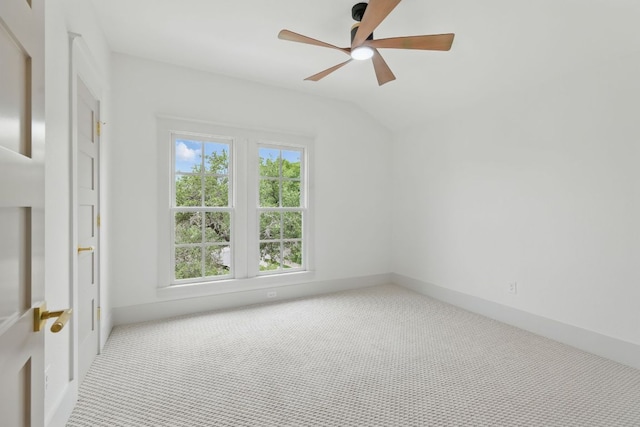6905 Rudi Cv, Austin, TX 78759 - spare room featuring carpet flooring, lofted ceiling, and a ceiling fan